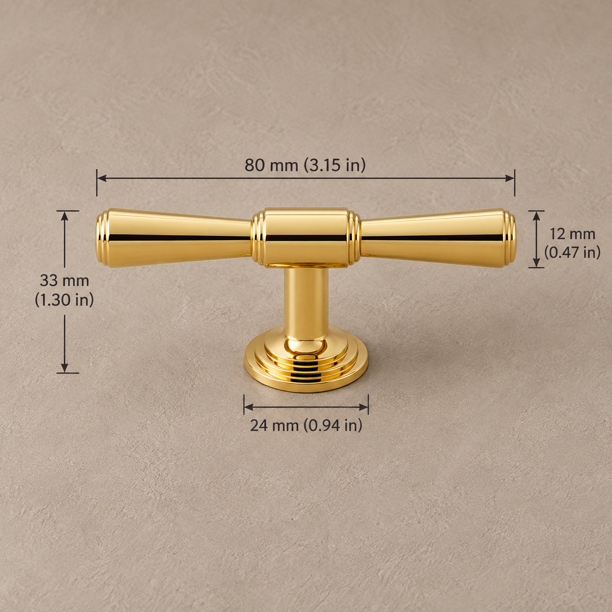 Polished gold cabinet 80mm t handle on taupe plaster, dimensions in mm and inches