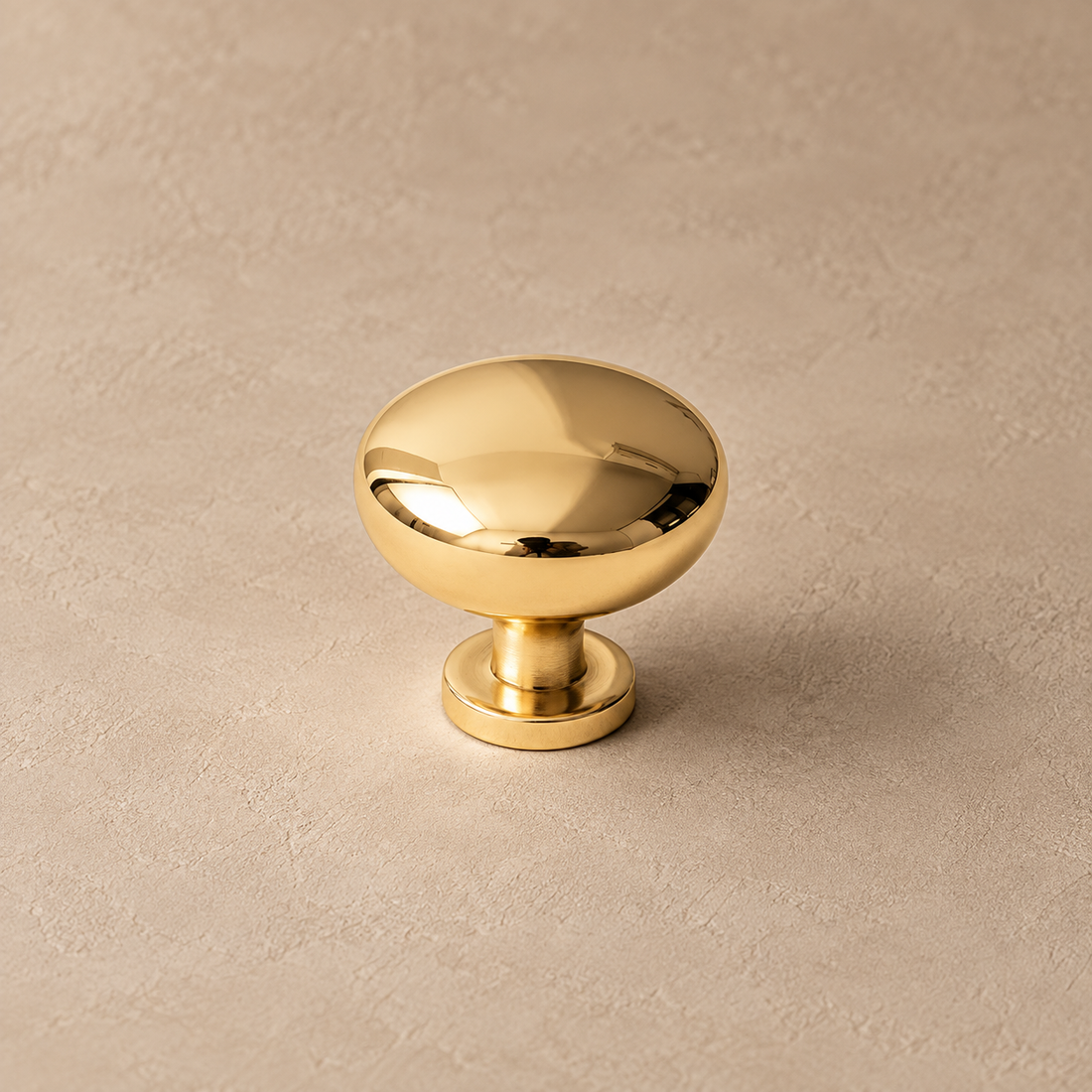 Polished Brass Cabinet Pulls & Knobs — Modern Design on a neutral stone studio background