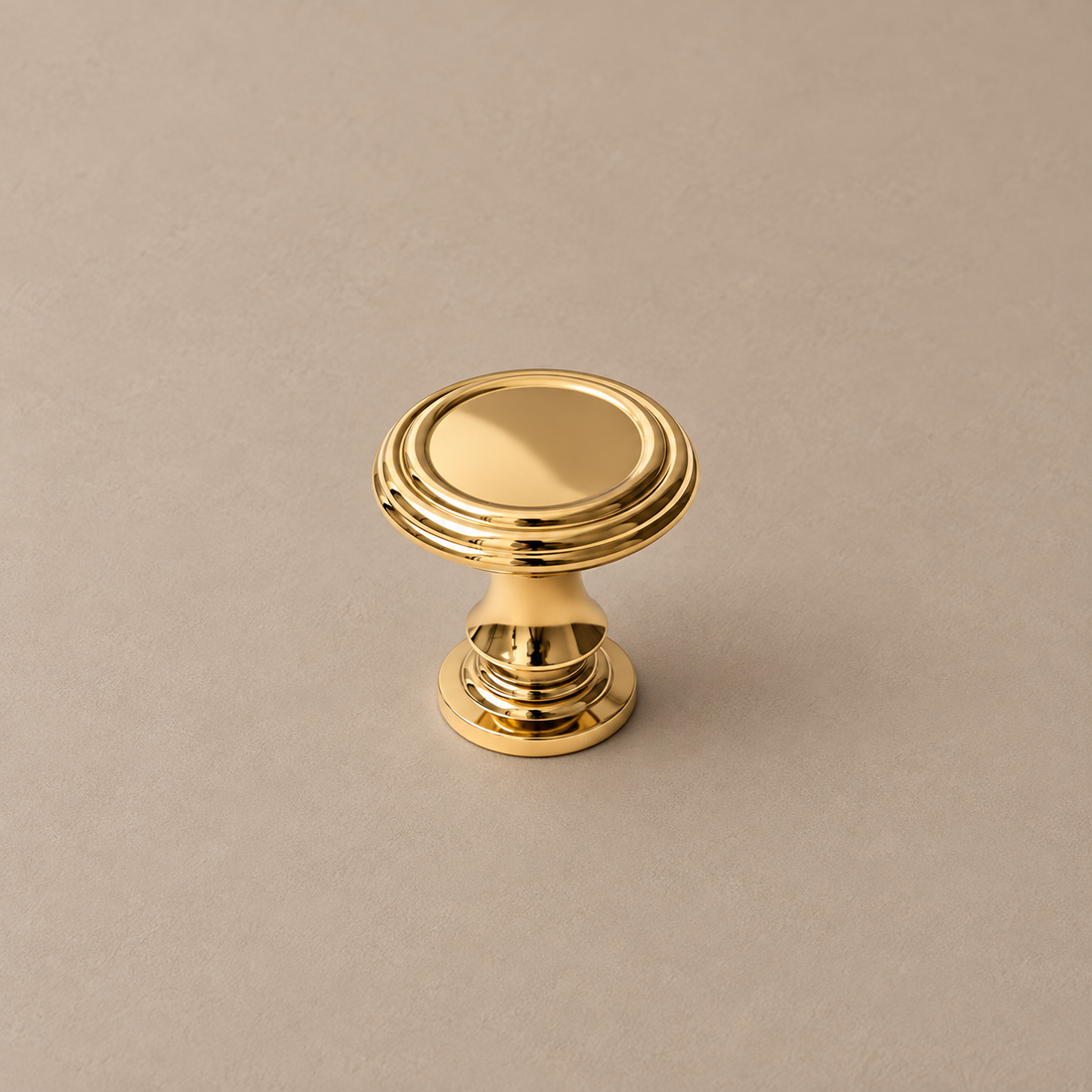 PVD Bright Gold Cabinet Pull & Knob — Solid Brass on a neutral stone studio background