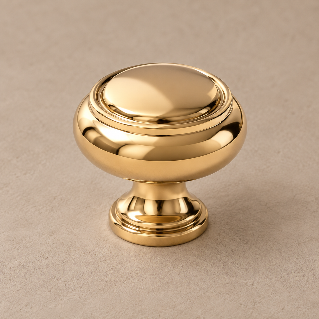 Solid PVD Gold Brass Cabinet Pull & Knob — Modern Luxury Design on a neutral stone studio background