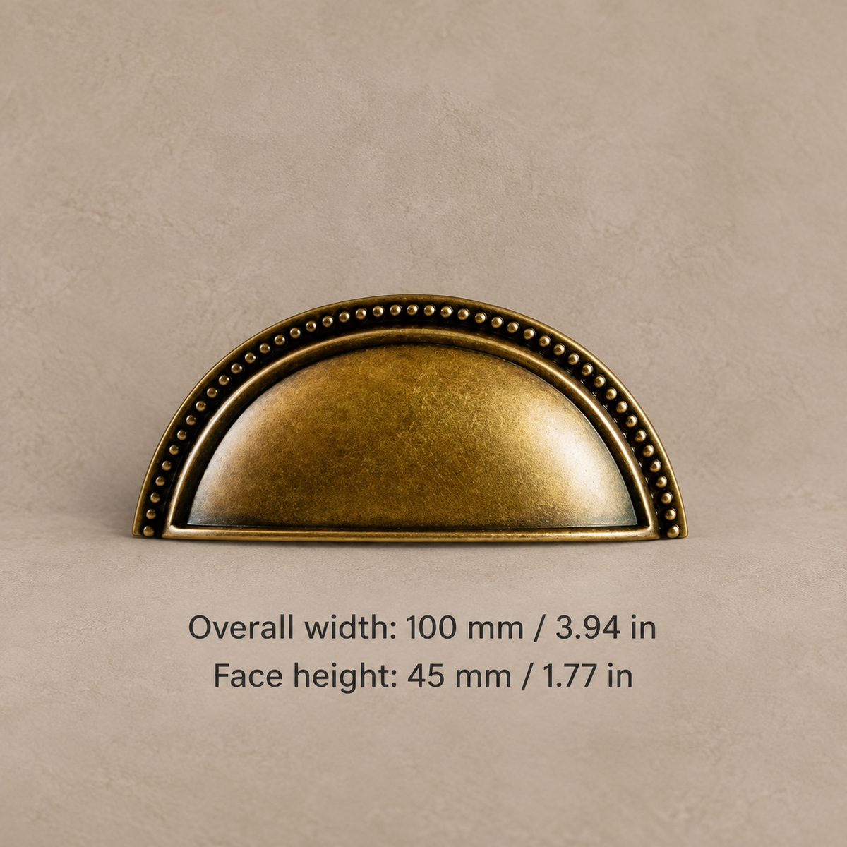 Antique bronze cup pull with 100 mm (3.94 in) overall width and 45 mm face height