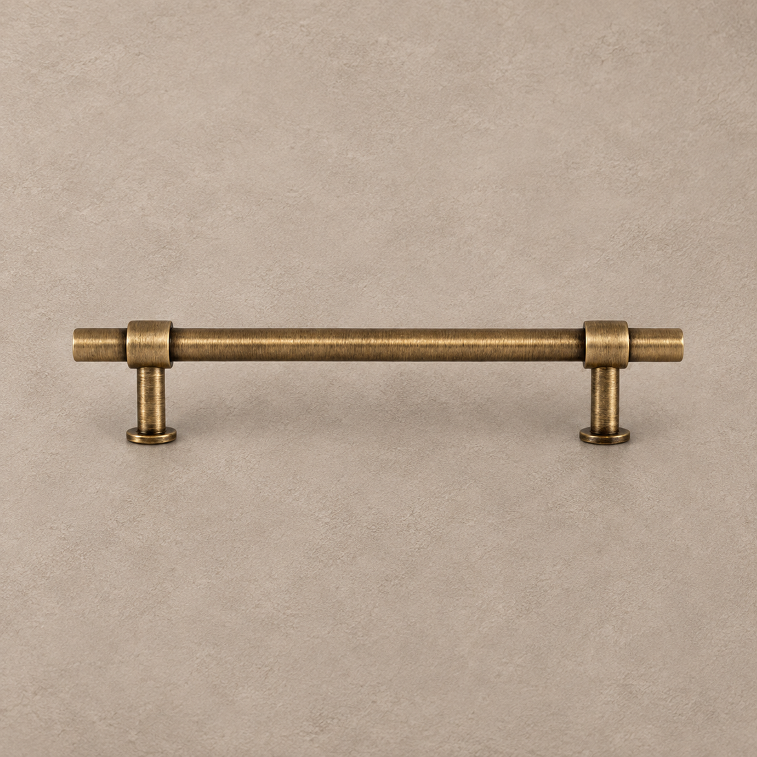 Antique Brass Solid Brass Cabinet Pulls & Knobs — Simple Modern Design on warm ivory stone