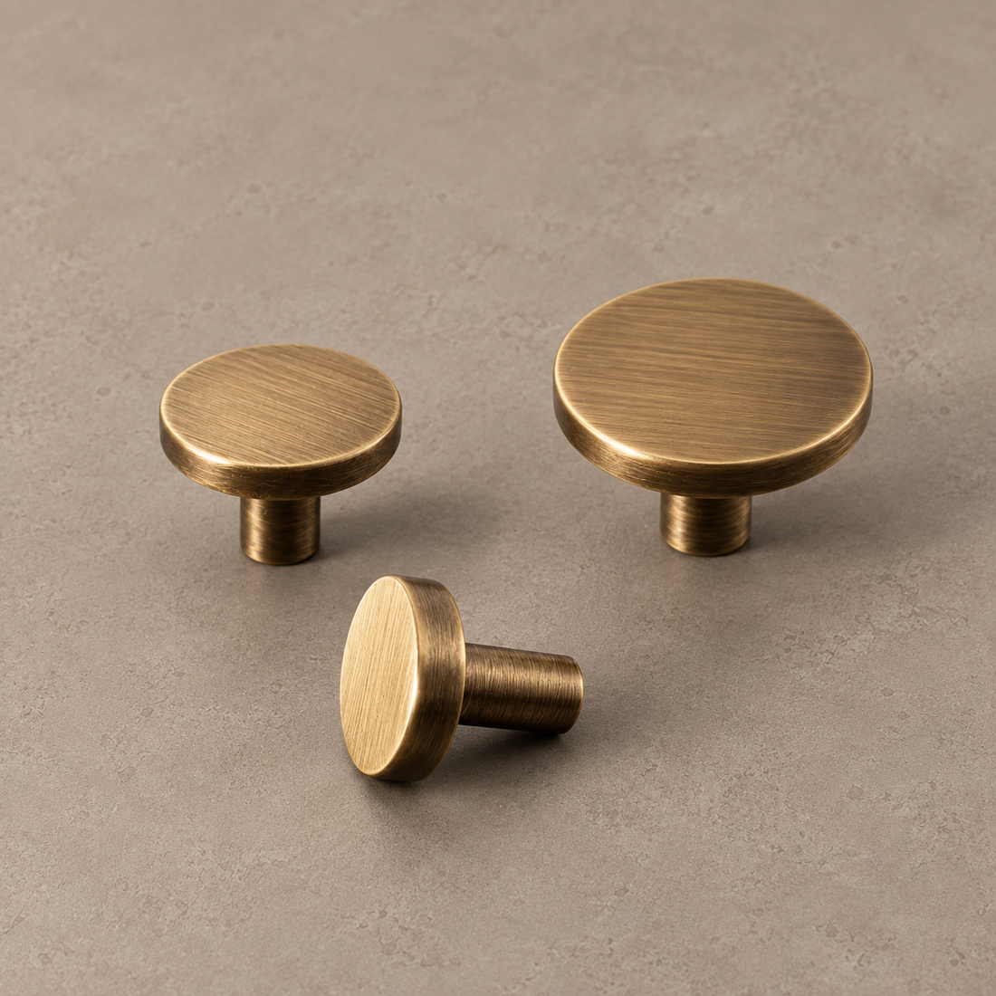 Square Bar Cabinet Pull & Knob — Antique Brass on a neutral stone studio background