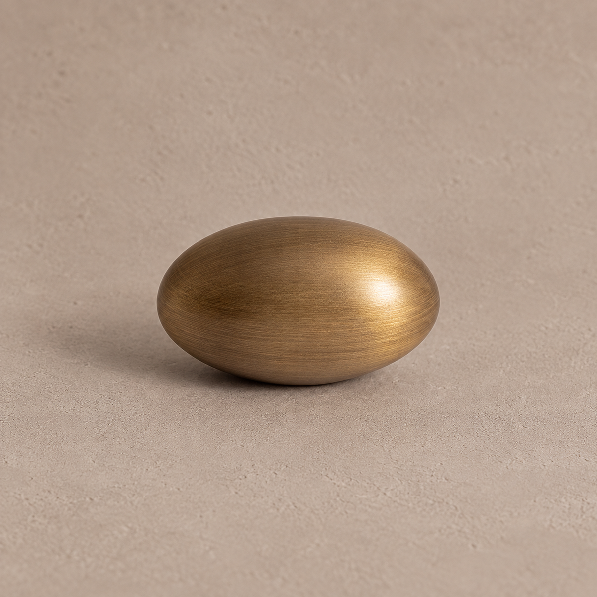 Antique brass low oval cabinet knob detail